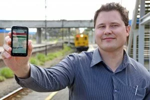 Software ace Justin Coetzee shows how accurate and user-friendly the train commuter information application is that he developed for cellphones. Picture Ian Landsberg